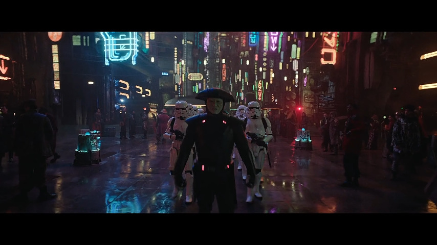 An Inquisitor leads a troop of Stormtroopers in the neon lit city of Tattooine