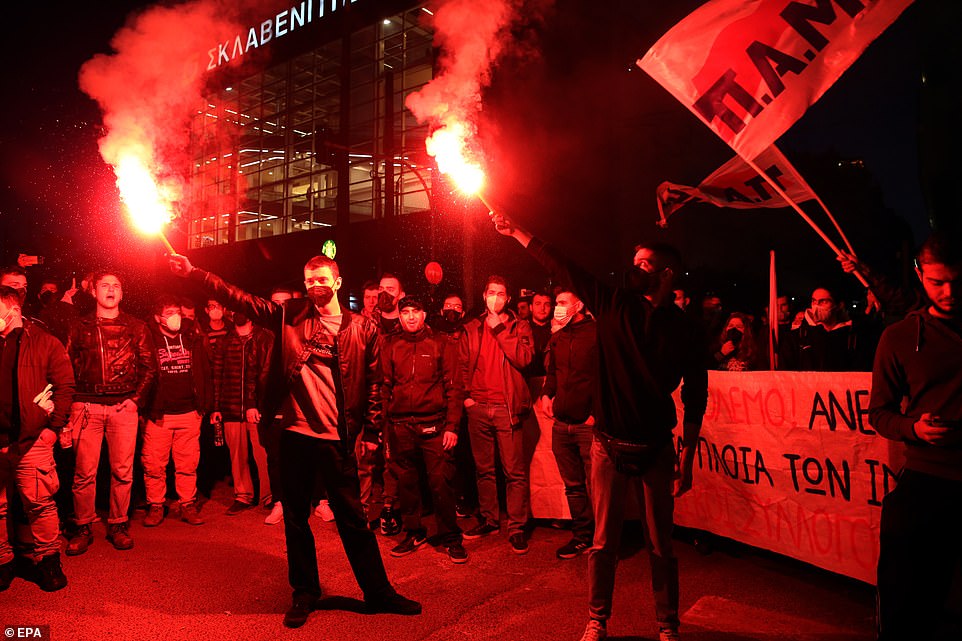 Protesters take part in a rally, called by the Piraeus Labour Union