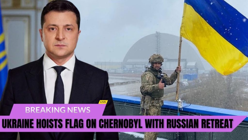 Ukrainian soldier proudly poses with flag at recaptured Chernobyl nuclear power plant