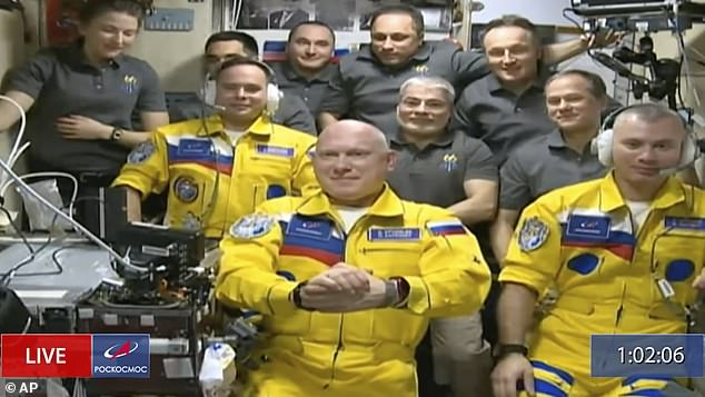 Three Russian cosmonauts arrived at the International Space Station wearing yellow and blue flight suits in late March
